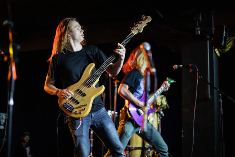 Student playing bass guitar