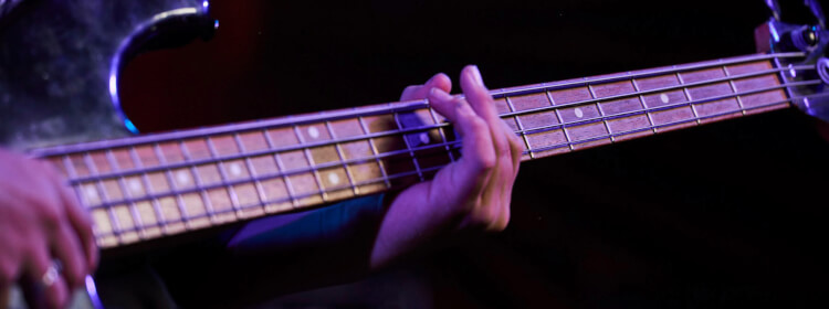 Kid learns to play bass at School of Rock Davie